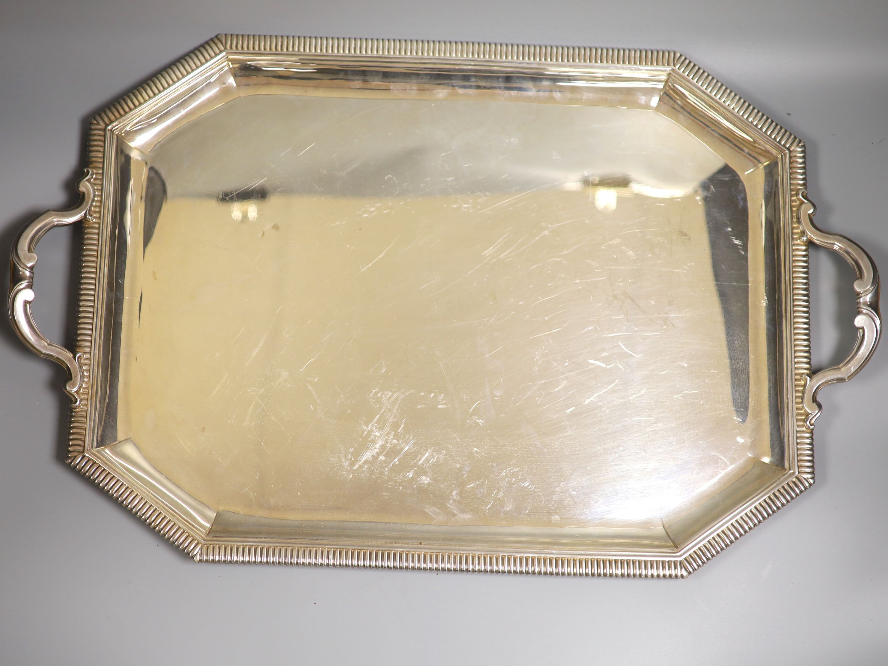 A 20th century French 950 standard white metal two handled tea tray by Emile Puiforcat, 64.5cm over handles, 132.5oz.